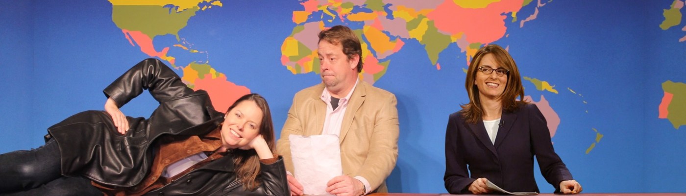 SNL's Weekend Update set with a superimposed Tina Fey